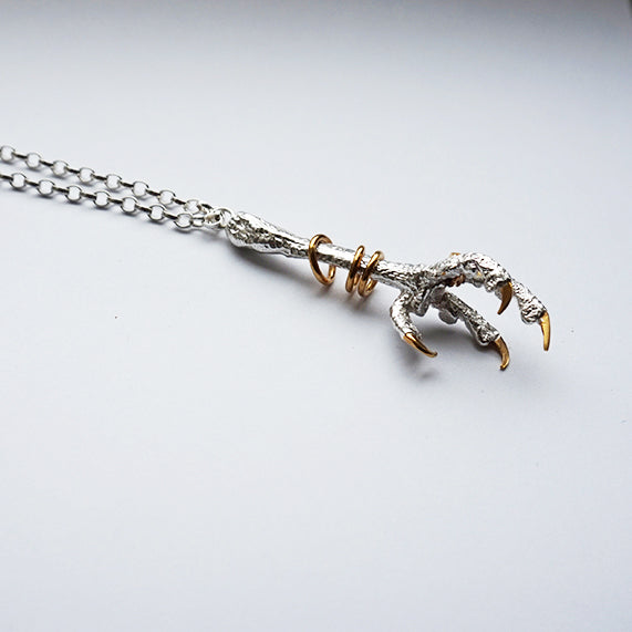 Sterling Silver Kestrel Bird Claw with gold bangles and nails Pendant